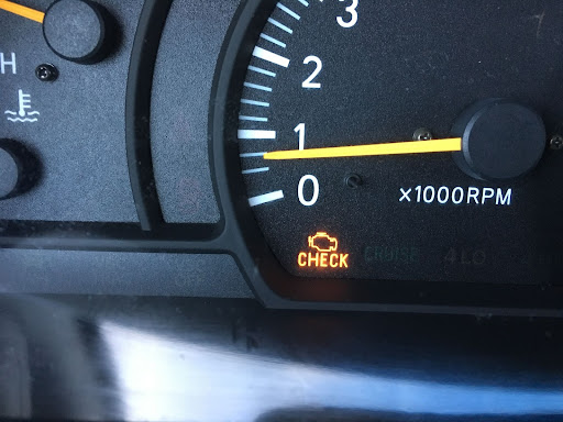 a check engine light lit up in a car interior
